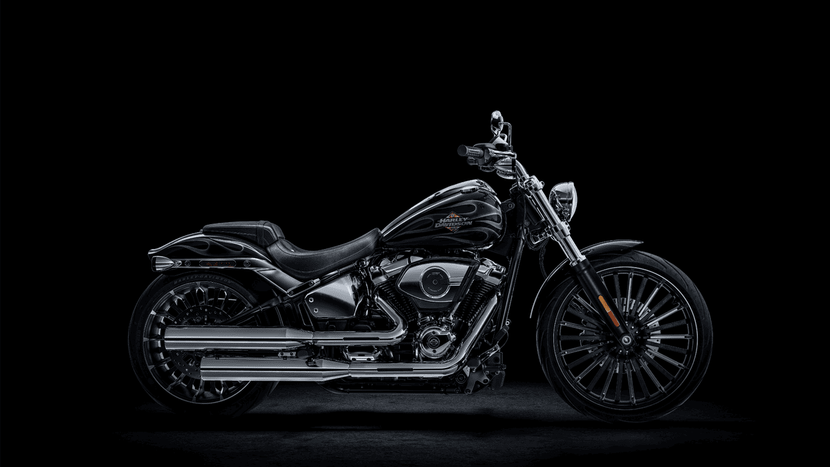 2025 Harley-Davidson® Breakout® in sleek black finish near Missouri City, TX, highlighted against a dark backdrop to emphasize its custom chopper design.
