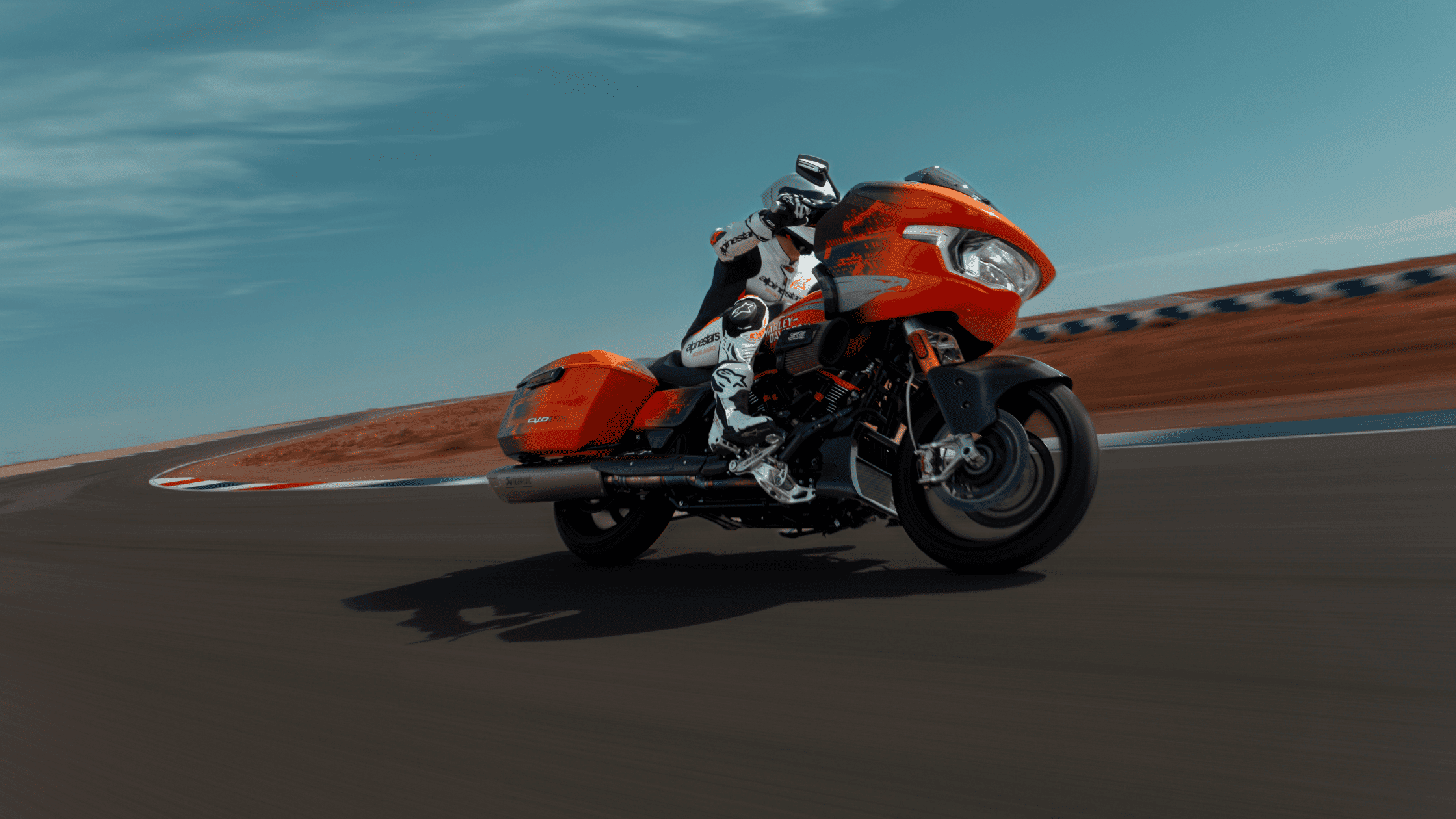 A motorcyclist on a 2025 Harley-Davidson® CVO™ Road Glide® RR, enjoying a ride on a beautiful road in Houston, TX.