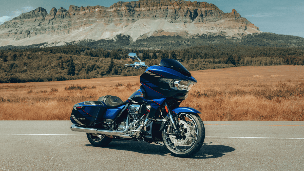 2025 Harley-Davidson® CVO™ Road Glide® in vibrant red parked on a city street—ready to turn heads with custom performance near Bellaire, TX.