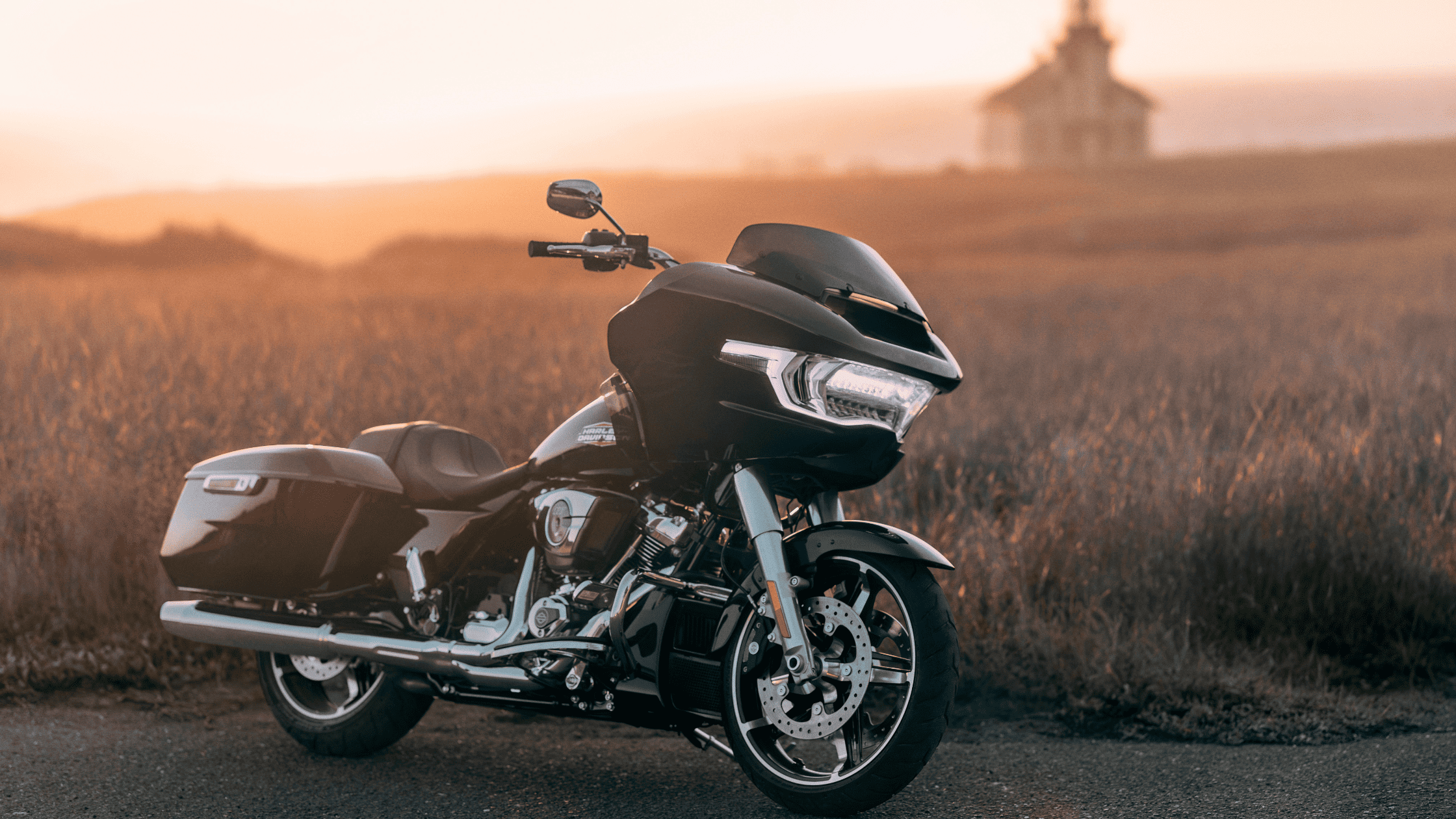 A 2025 Harley-Davidson® Road Glide® parked on a road at sunset near Stafford, TX.