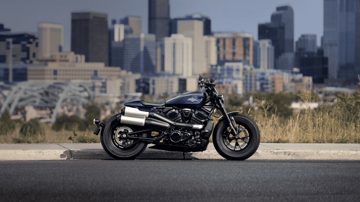 2025 Harley-Davidson® Sportster® S parked with an urban skyline backdrop near Bellaire, TX, featuring a modern, performance-focused stance.