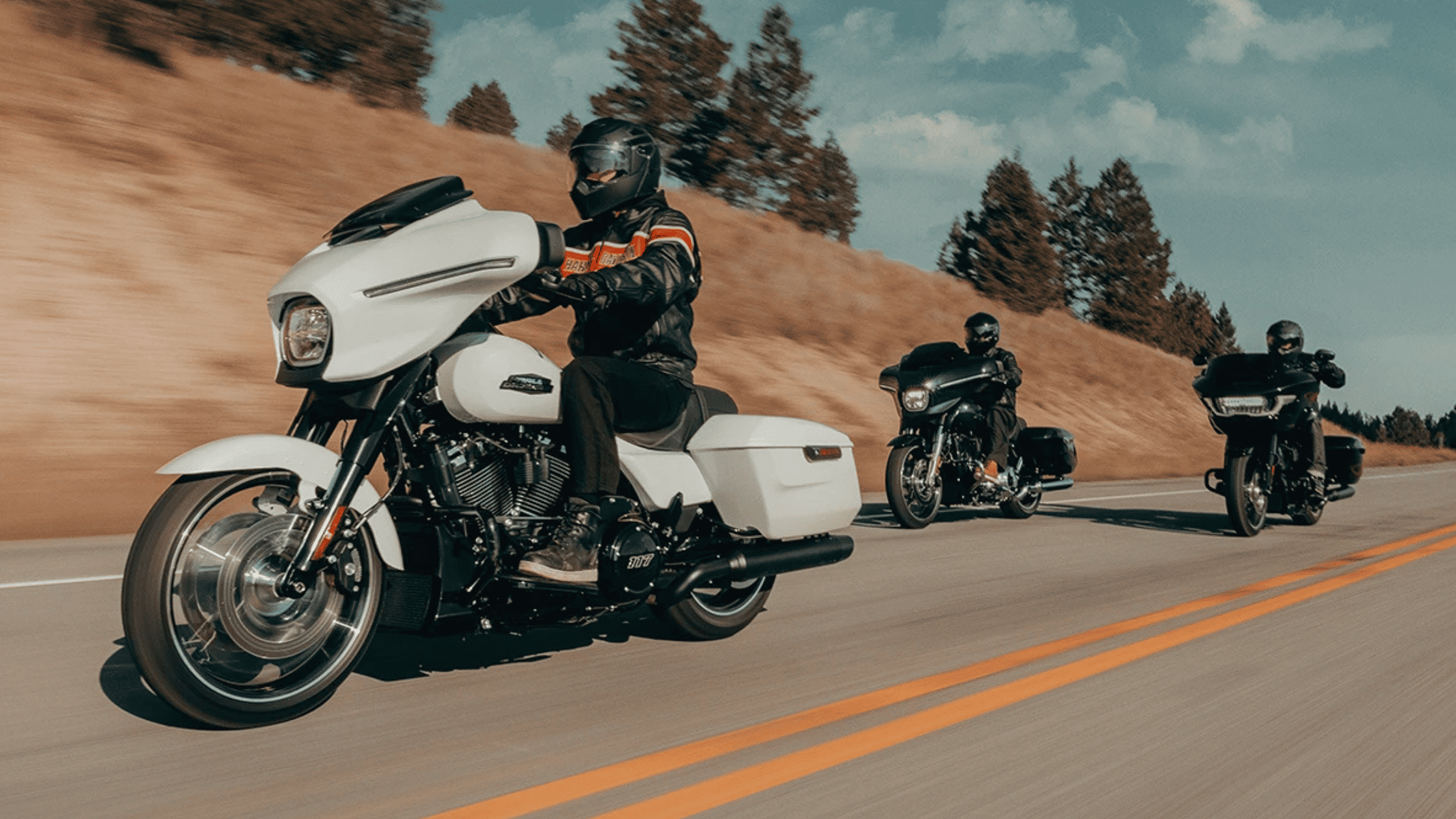 Three men ride along Houston, TX with 2025 Harley-Davidson® Grand American Touring Motorcycles