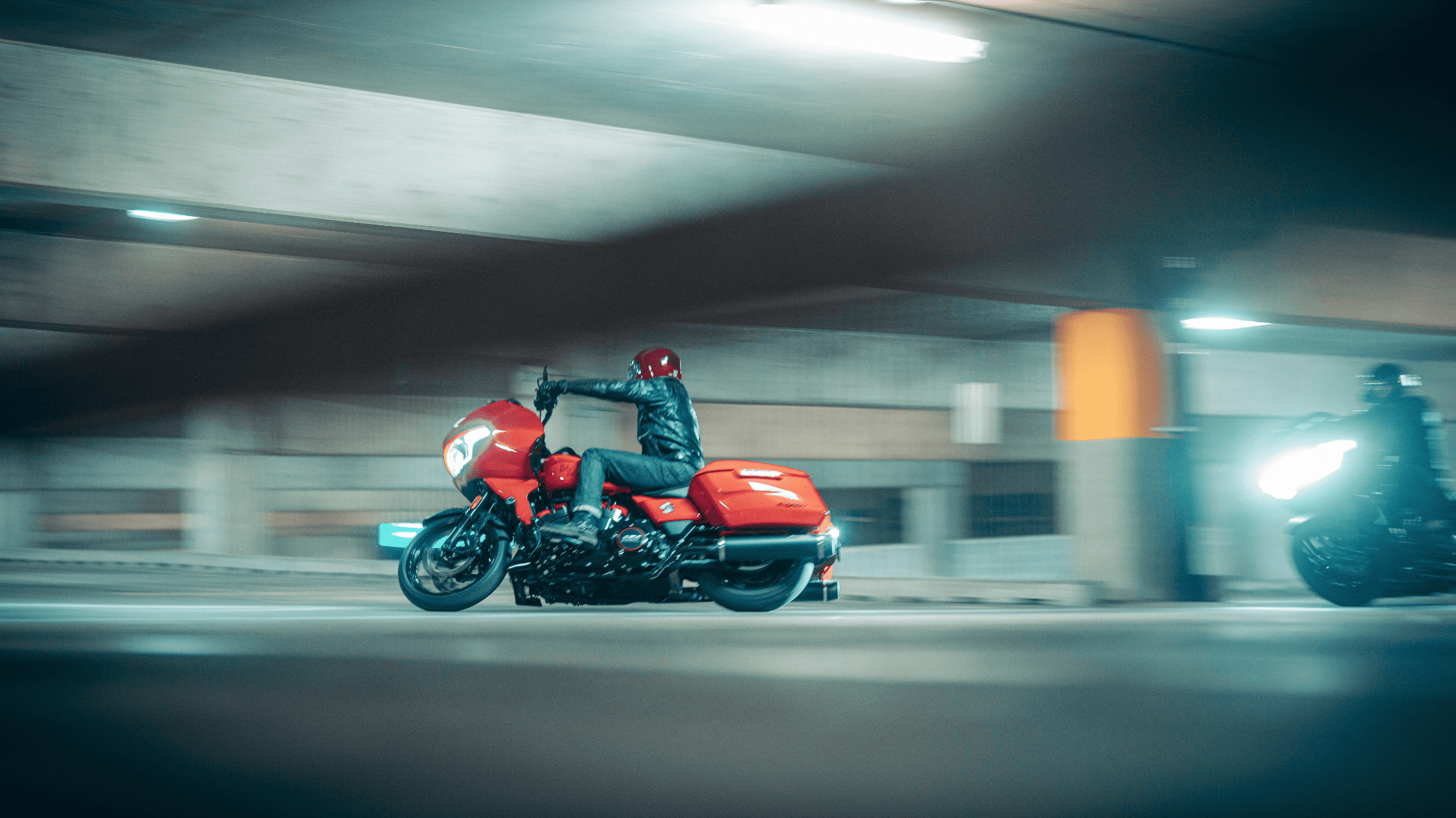 A person rides a 2025 Harley-Davidson® CVO™ Road Glide® ST in a dimly lit parking garage in Houston, TX. Available at Stubbs Harley-Davidson®
