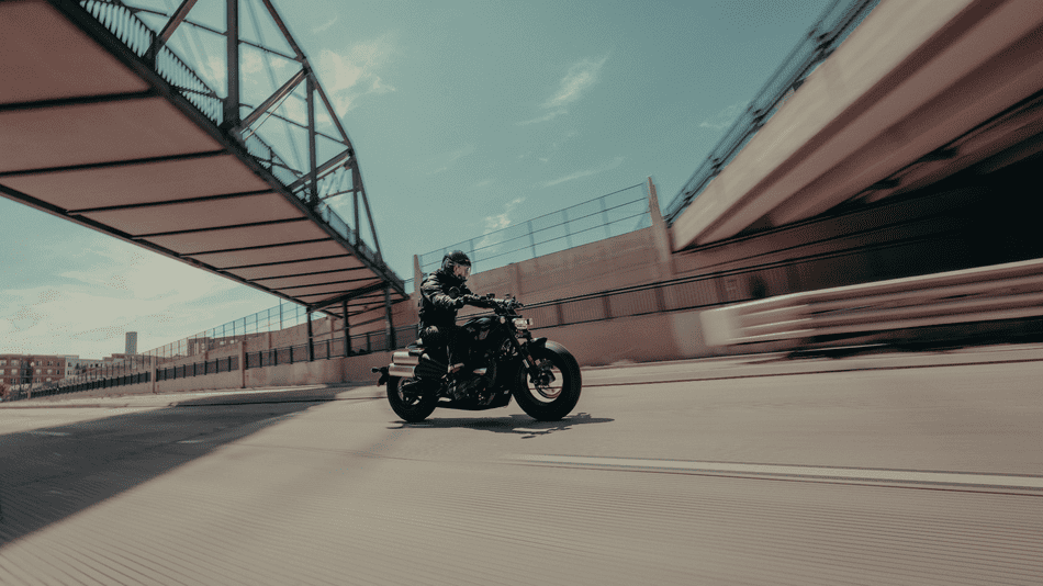 2025 Harley-Davidson® Sportster® S slicing through an urban overpass near Bellaire, TX, built for performance and modern street agility.