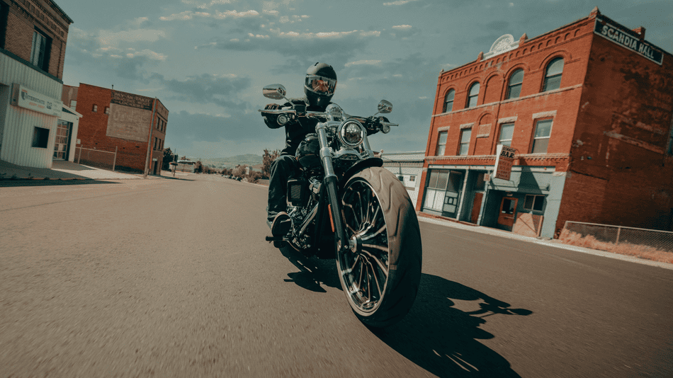 2025 Harley-Davidson® Breakout® in gloss black finish, shown on a black background with custom wheels and drag-style bars near Missouri City, TX.